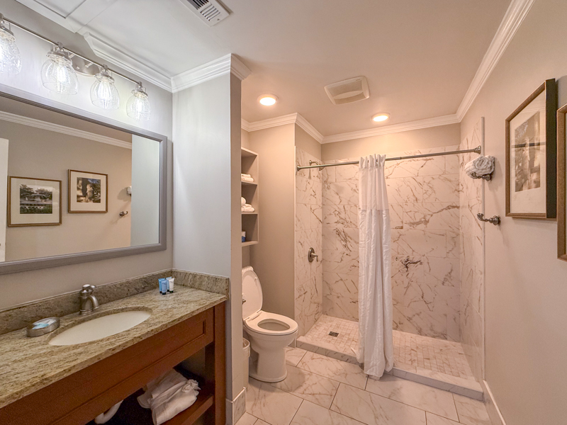 a bathroom with a shower and sink